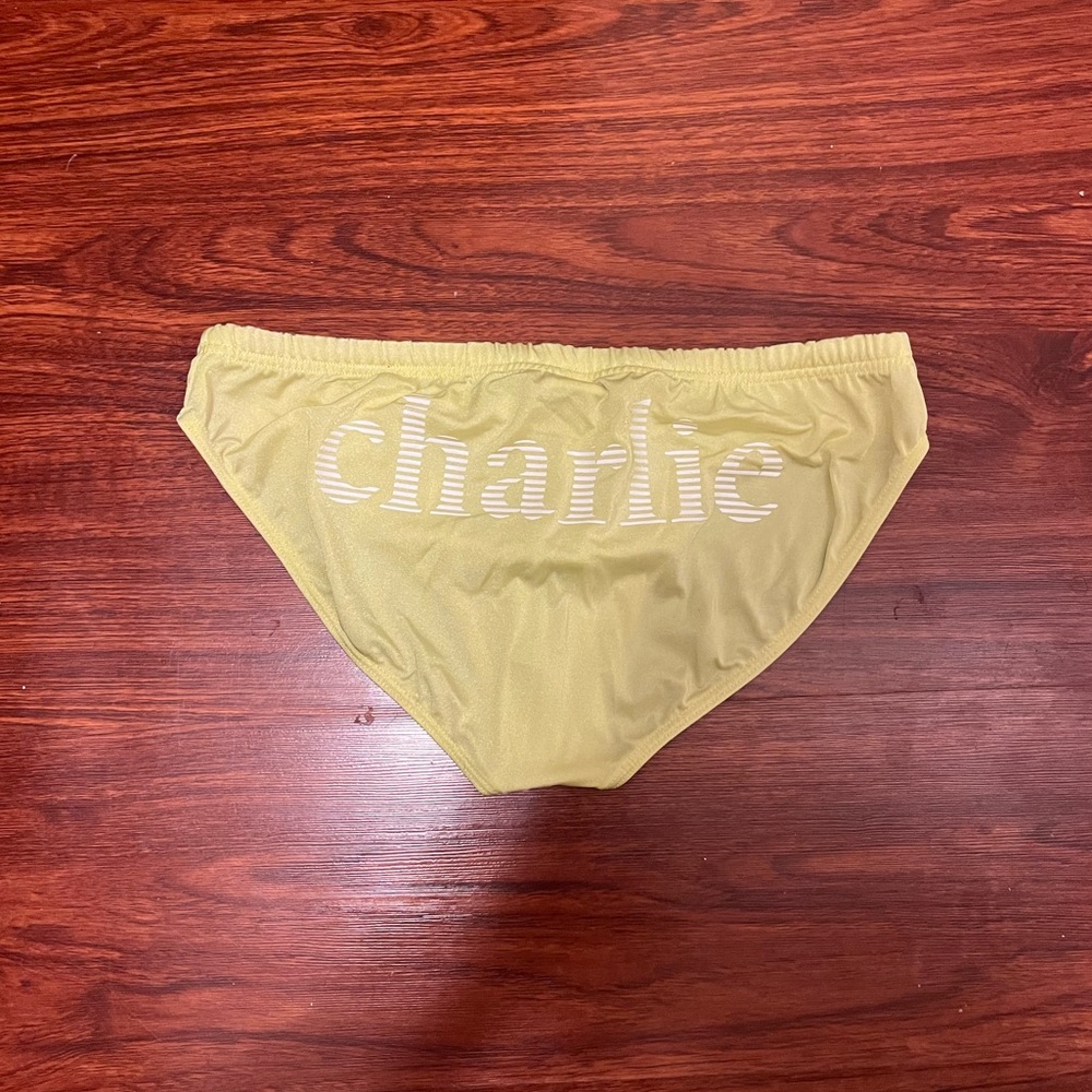Charlie by Matthew Zink citron colored speedo with logo.